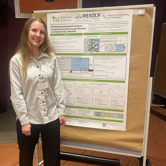 Luzie Klöckner and her poster at the 2026 RESOLV Retreat.